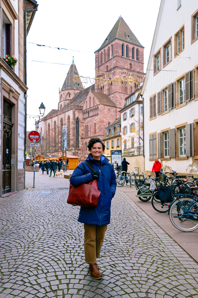 Woman exploring the streets of Strasbourg, France at Christmas