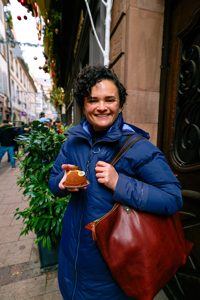 Enjoying a delicious pastry in Strasbourg, France at Christmas