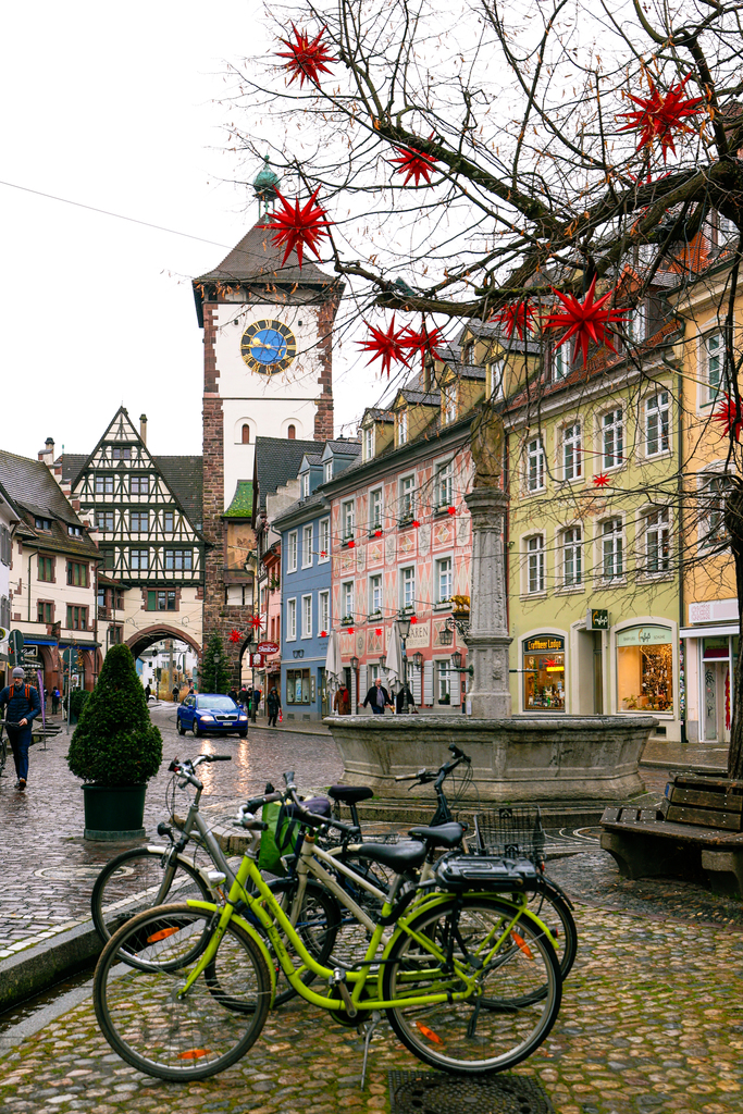The festive streets of Freiburg Germany in the rain at winter near christmas time