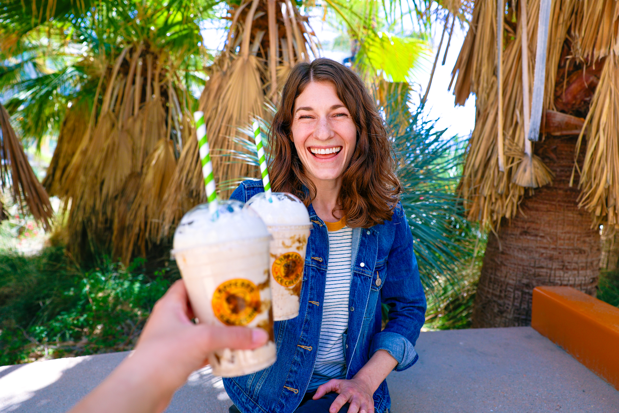 Getting a date shake is one of many unique things to do in Palm Springs, California! Woman holding a Lappert's Date Shake in Palm Springs.