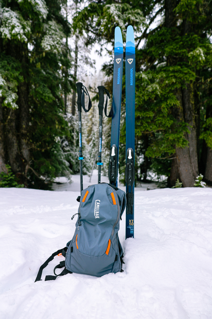 Couple cross country skiing equipment