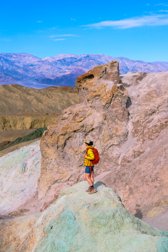 Colorful rocks and soil at Artists Palate in Death Valley National Park, with views overlooking the mountains.