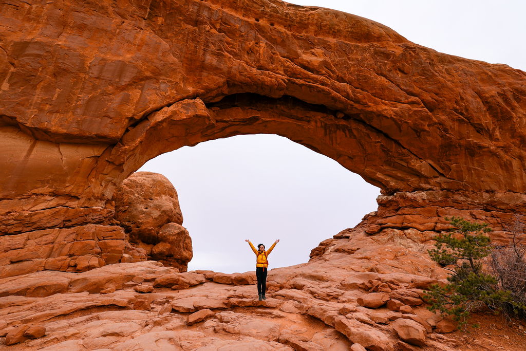 Woman in front of North window along the Windows Trail in arches national park
