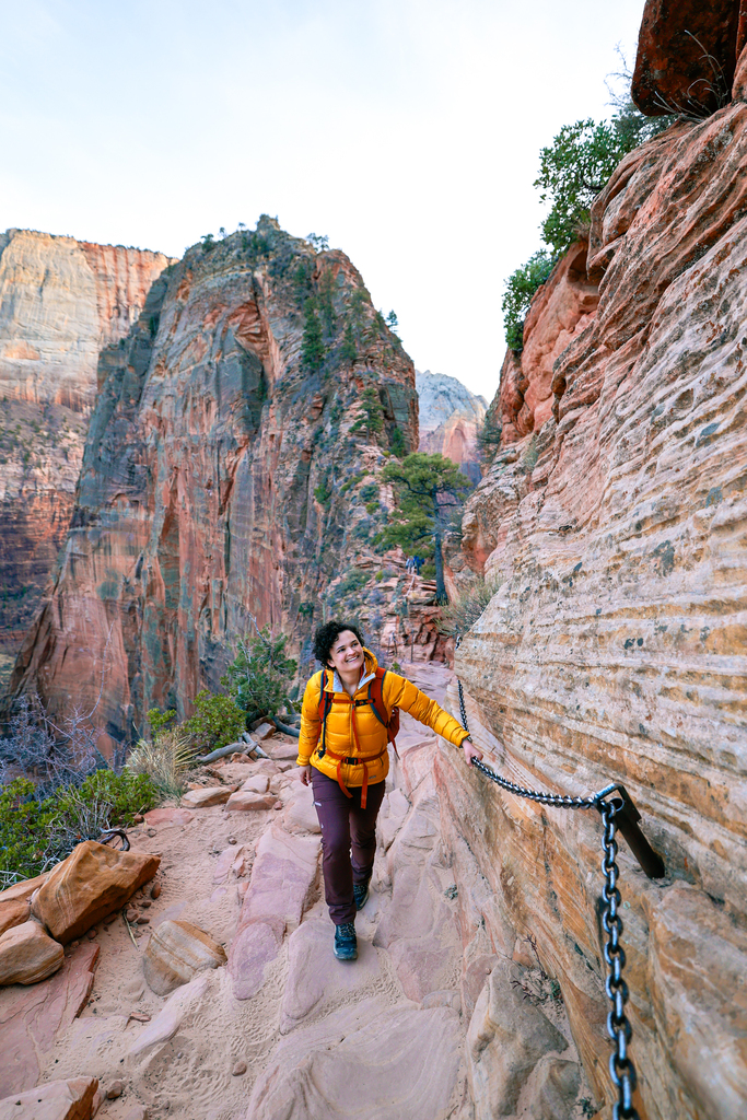 A woman doing the Angels Landing hike in Zion National Park
