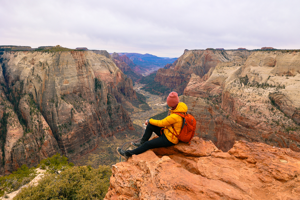 Woman looking at the view from observation point in Zion National Park