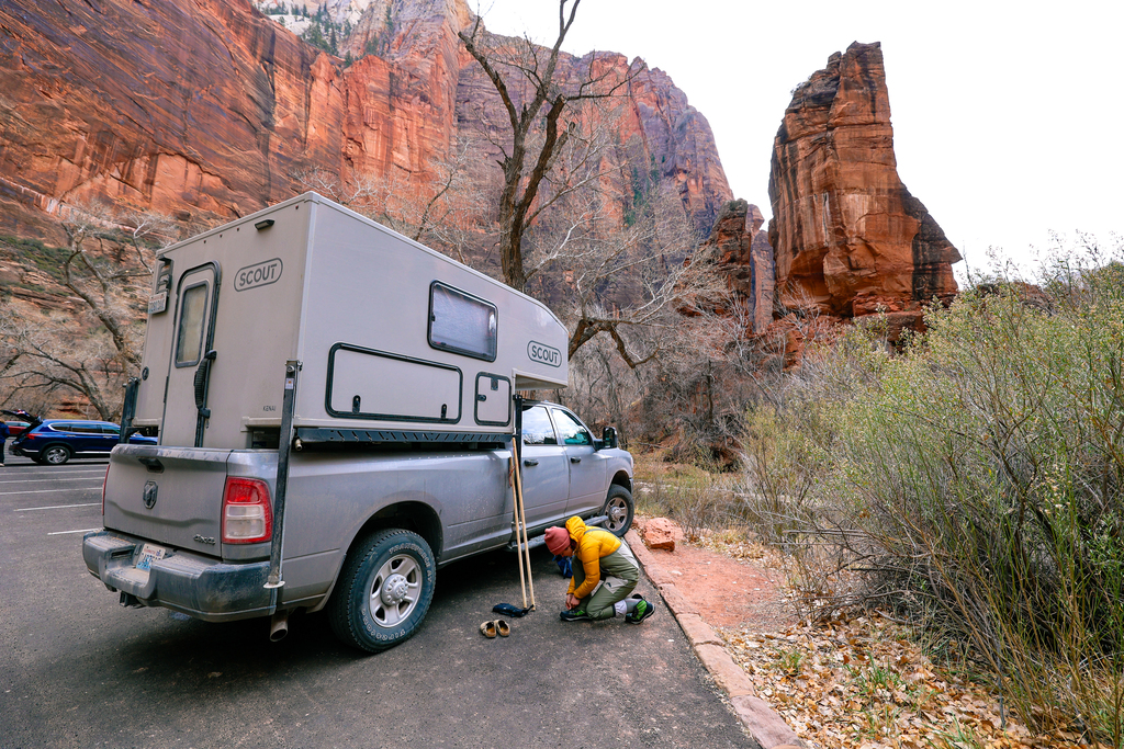 Putting on gear to hike the narrows in winter in zion national park