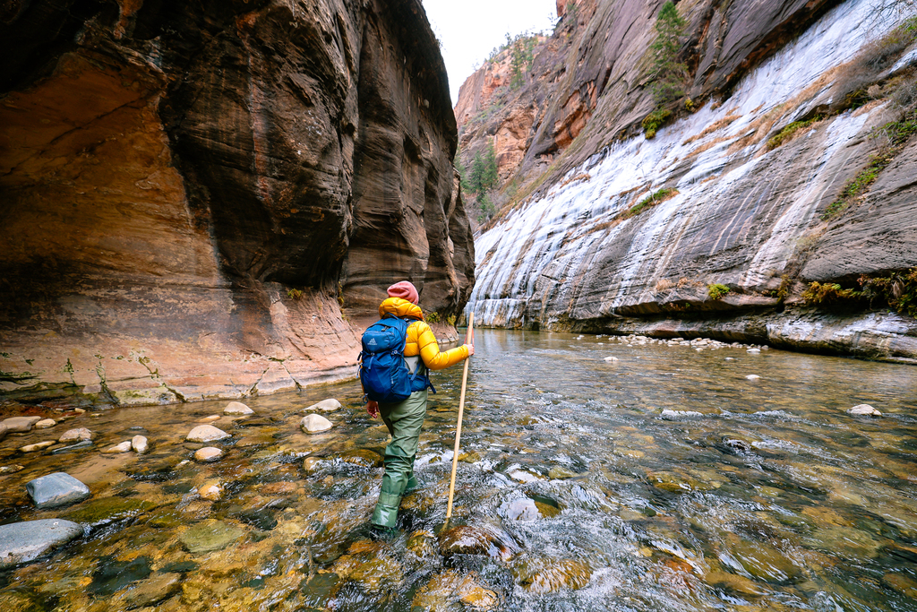 Woman hiking the narrows in winter